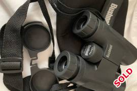 Bushnell 10x42 Powerview Binocular, as new. , High-magnification, full-size viewing ideal for long-range observation. Features fully multi-coated optics and multiple layers of anti-reflective coating on all air-to-glass surfaces deliver bright, high-contrast images.