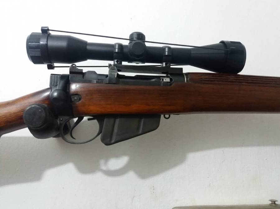 1942 long branch Lee Enfield, Rifle in pristine condition. Original and  matching serial numbers. Mount and scope. Threaded with silent hunter  (suppressor). Plus 200 rounds of 303 British ammunition. Price is  negotiable.