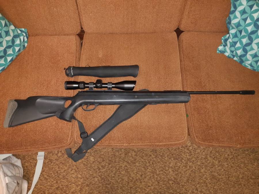 Hatsan Mod125 Air Rifle, 1200fps, with Scope and belt. Still have its box and open sight. 