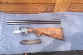 sidexside shotgun, good condition.less than 500 rounds through the barell.no pitting or fading