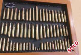 63 Classic rifle calibers in a frame, 63 Classic rifle calibers in a frame, 63x Deactivated classic cartridge collection. Including  the much loved 22 BB cap  and monsters like 458 Win, 416 Rigby and a Kynoch 470 Nitro. I have a full list if you cant read the photos. No permit required. Perfect for a mancave/reloading room. You wont sommer find another, unless I made it. R3995. Trevor Kensington
