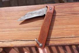 Vintage Okapi, Vintage made in Germany Okapi folder. Wood handle with square cut pattern. Wood is in a good condition. Blade worn as a vintage knife would be. Rare find.