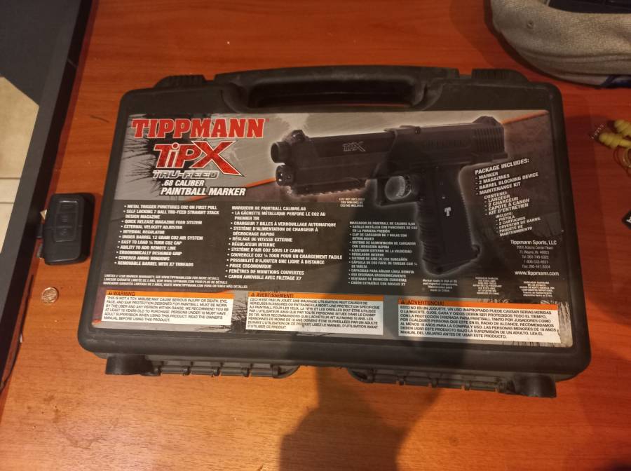 Tippmann X Painmtball HandGun, Comes with case
Comes with exstra magazine
Comes with a Addition add on laser pointer

 