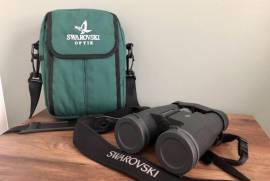 Swarovski Binoculars SLC 7x42, Swarovski Optik Binoculars SLC 7x42B Excellent condition besides slight discoloration on adjustment knob does not affect use in anyway no scratches or any other defects included is the lens caps/covers padded neck strap and padded carry bag and binoculars.

 