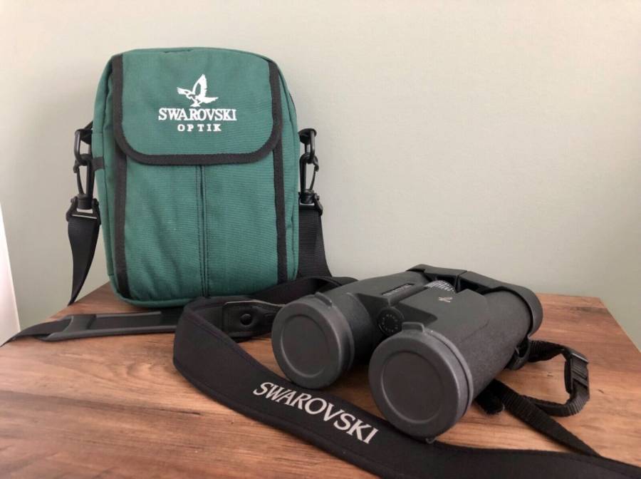 Swarovski Binoculars SLC 7x42, Swarovski Optik Binoculars SLC 7x42B Excellent condition besides slight discoloration on adjustment knob does not affect use in anyway no scratches or any other defects included is the lens caps/covers padded neck strap and padded carry bag and binoculars.

 