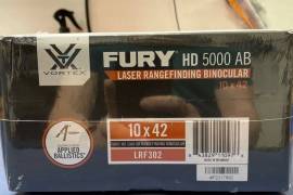 Vortex Fury HD 5000 AB 10x42 Laser Rangefinding , New, in box Vortex Fury HD 5000 AB Laser Rangefinding Binocular Equipped with Applied Ballistics, LRF302

Max Angle +/- 89 
Eye Relief: 16mm
Weight: 32.4 oz

Includes:
Glasspak Binocular Harness
Comfort Neck Strap
Tethered Objective Lens Covers
Rainguard Eyepiece Cover
Range:
Minimum: 5 yds
Deer: up to 1600 yds
Trees: up to 2400 yds
Reflective: up to 5000 yds
 