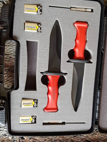 Training Shock knives, This is a set of shock knives used for knife fighting training. can be set for low medium and high. Works with 9V battery. Imported. Some battle damage but not to the functionality of the equipment. 1 Safety goggle included
Postnet shipping included in p