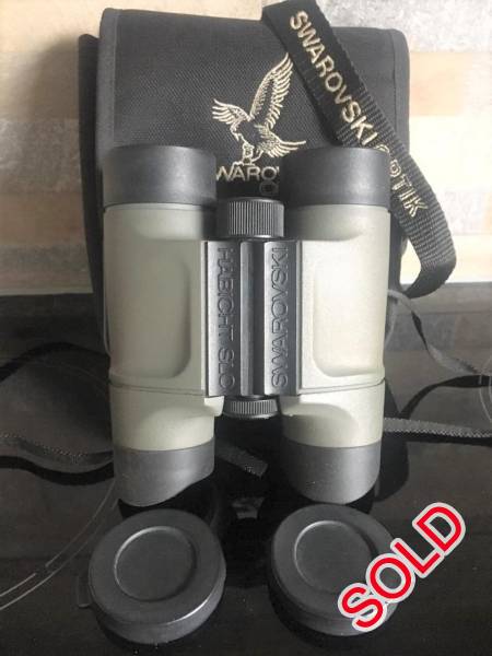 Swarovski 8x30 SLC Habicht Roof Prism Binoculars , Swarovski Optik Habicht SLC 8x30 WB binoculars. Green color. Made in Austria. Excellent condition overall. No fog or fungus. Bright, sharp, and life-like images with wide field of view.
Body is also in excellent condition. Smooth focus wheel. Locking diopter adjustment for right eye. Has winged eyecups that fold down to accommodate eyeglass wearer. Includes a Swarofski pouch. Photos are of the actual item.