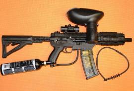 Tippmann A-5 paintball gun, Comes with the following: 

Response Trigger (upto 15balls/sec)

Killhouse HK416 weapon system

Adjustable stock

Hawkeye Reflex red dot system

12 ounce co2 bottle(empty)

extras

1 X squeegee
