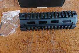 AIM Sports M4 carbine drop in Quad Rail, Bought this to fit to my rifle I'm still awaiting licensing for. Decided to go the free float route instead. Thus I don't have need for this. Never been used or fitted to a weapon. 
Still Brand New. 
R500 excl shipping. 

The M4 carbine length drop-in quad rail is an easy to install upgrade for the basic carbine. Made of black anodized aircraft grade aluminum and compatible with most direct impingement gas systems. When installing the two-piece design no gunsmithing is required. 