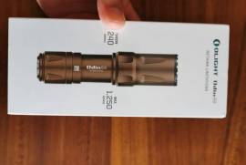Olight Odin Mini Tactical , Brand new Olight Odin Mini Tactical Torch for sale. Desert Tan colour. Still sealed in box. Courier cost for buyer. Price reduced to R3000. Please contact Ricardo on 0836078066 if you are interested.