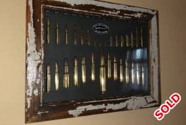 30x Classic rifle cartridge frame., 30x Classic rifle cartridge frame., 30x Classic rifle cartridge frame. All cartridges are deactivated, no permit required. From the diminutive .22 BB Cap up to the infamus .50 BMG as used in the legenday Barret sniper rifle. Kensington.   R1550.
