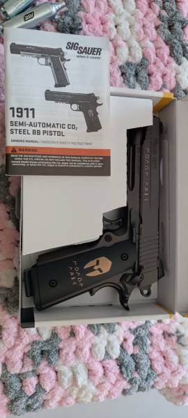 Sig Sauer SPARTAN 1911 Replica Co2 BB Pistol, I bought this in October. Used 1 mag. Put it away. No space to use it.
it's a replica in every way of the Spartan 1911 limited edition.

Comes with 7 gas cartridges, 1000 BBs, older holster, in box with booklet still. This is mint!!!