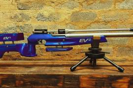 Air Arms EV2 Target PCP Air rifle, Air Arms EV2 Target PCP Air rifle in .177 (4.5mm) with a stunning blue fully adjustable target stock. Made in England. The EV2 is a purpose build sub 12fpe field target rifle with Lothar Walther competition barrel. Features a hamster, swing-out level and wind indicator, factory regulator, adjustable butthook and cheek piece, adjustable trigger and muzzle brake and bag. In excellent condition. R16000
 